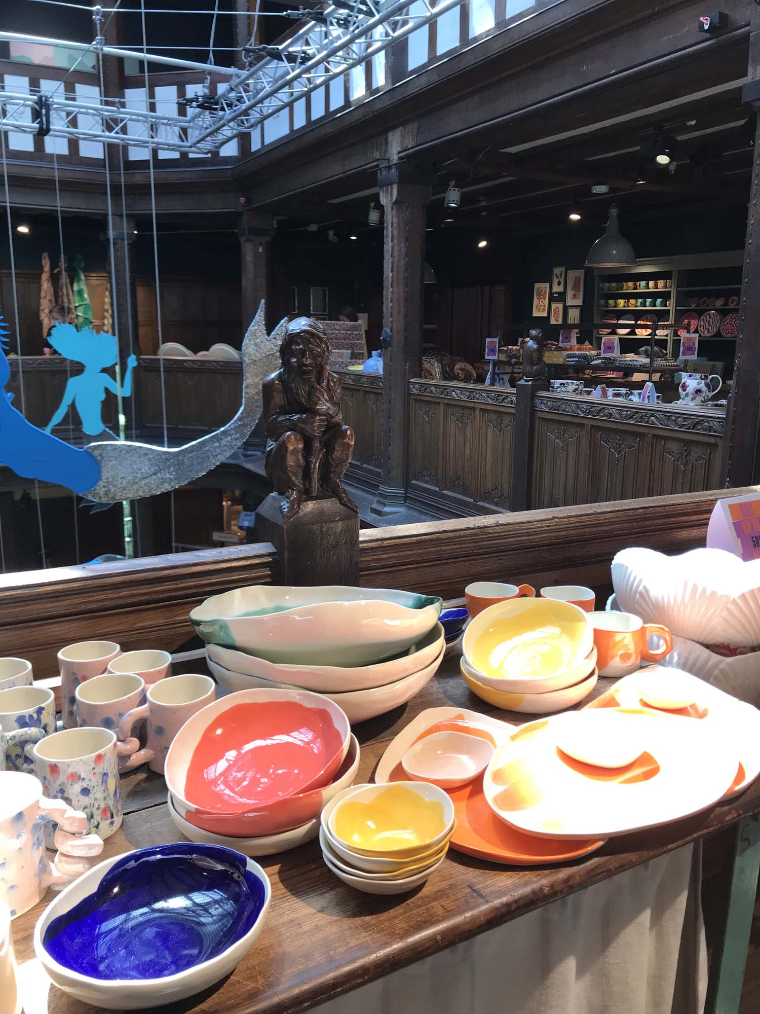 Display of colorful handmade ceramics by Pottery & Poetry at Liberty London.