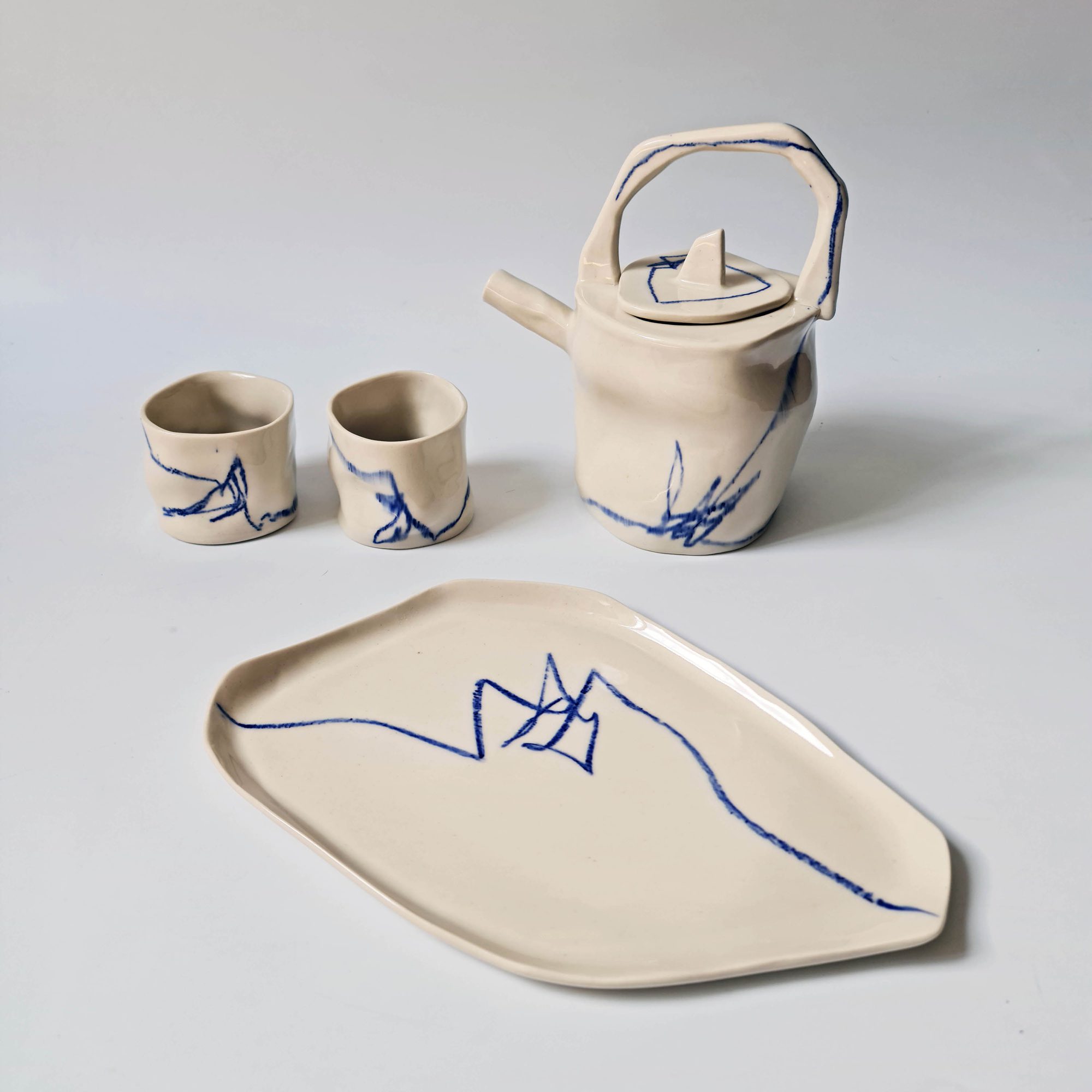 indigo tea set, teapot, cups and a tray